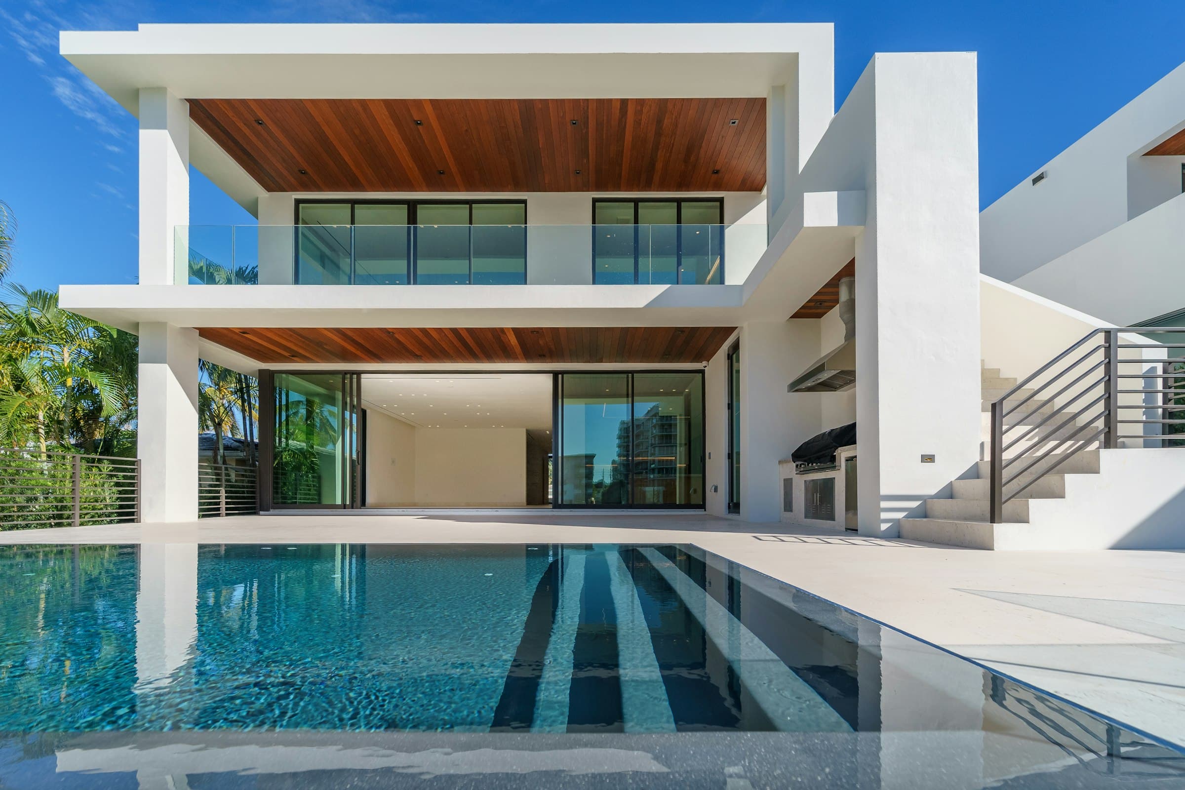 Modern pool villa with palm trees